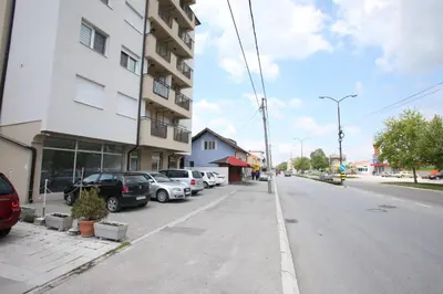 a street with cars parked on the side of a building at Fast Sleep & Go 3 in Paraćin