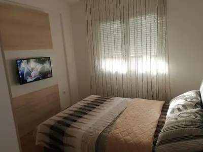 a small bedroom with a bed and a window at Fast Sleep & Go 3 in Paraćin