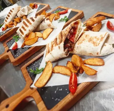 a bunch of different types of food on a table at Hotel Royal Putnik in Vranje