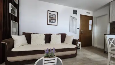 a living room with a couch and a table at KOP P95 Milmari in Kopaonik