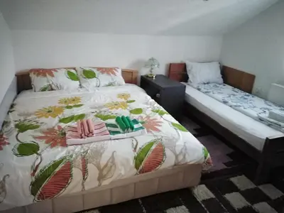 a bedroom with two beds with pillows on them at Apartmani Odmor i Mir in Vranje