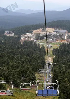 a gondola ride up a hill with people on it at Villa Zvončica, Apartman ViN in Kopaonik