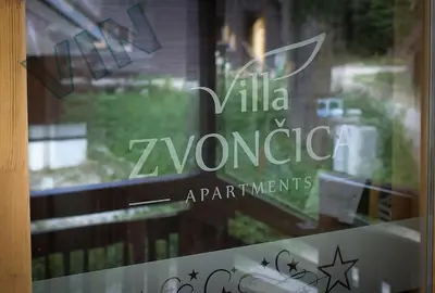 a window with a sign that reads villa navarroarmaarmaarmaagents at Villa Zvončica, Apartman ViN in Kopaonik