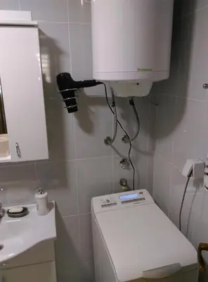 a small bathroom with a toilet and a sink at KIKI LUX Apartment in Vrnjačka Banja
