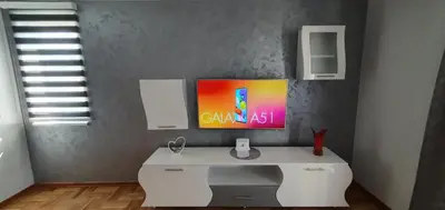 a white desk in a room with a painting on the wall at KIKI LUX Apartment in Vrnjačka Banja