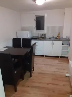 a kitchen and dining room with a table and chairs at Smestaj Stankovic in Soko Banja