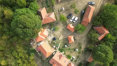 an overhead view of a house with a yard at Etno selo Milanovic - Nonac in Kuršumlija