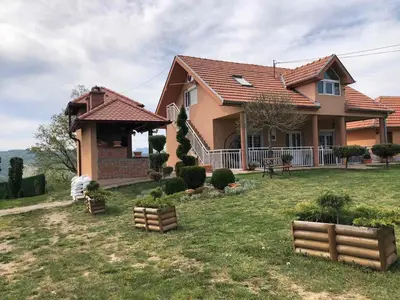a large house with a yard with a yard at Etno selo Milanovic - Nonac in Kuršumlija