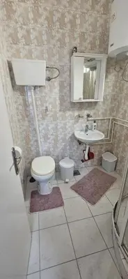 a bathroom with a toilet and a sink at Apartman Casa Lux in Vrnjačka Banja