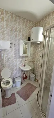 a bathroom with a toilet and a sink at Apartman Casa Lux in Vrnjačka Banja