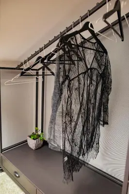 a curtain hanging on a wall in a room at Different Apartments in Niš