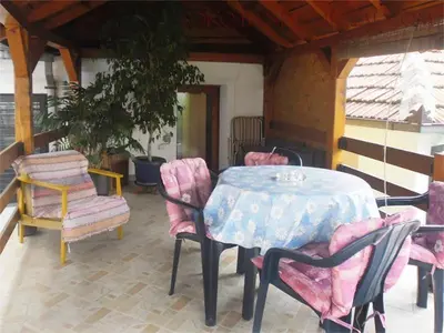 a table and chairs sitting on a patio at Apartman i Studio Stefan Nemanja Sokobanja in Soko Banja