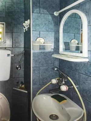 a bathroom with a sink and a mirror at Apartman i Studio Stefan Nemanja Sokobanja in Soko Banja