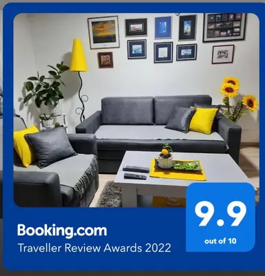 a living room with a couch and a table at Sunce in Kruševac