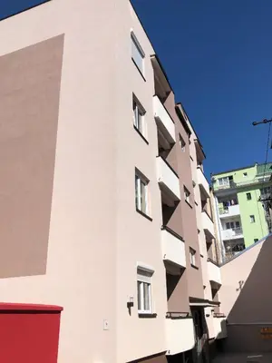 a white building with balconies on the side of it at Sunce in Kruševac