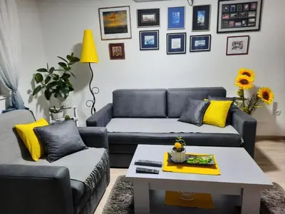 a living room with a couch and a coffee table at Sunce in Kruševac