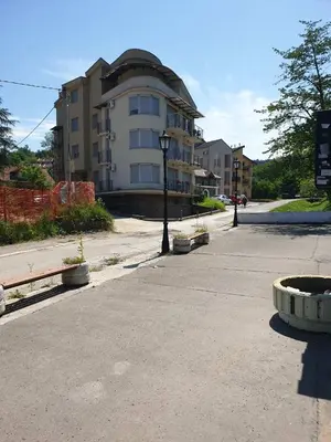 an empty street in front of a building at Happy in Vrnjačka Banja
