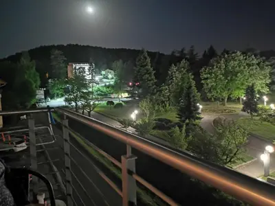a view from a balcony at night at Happy in Vrnjačka Banja
