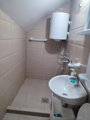 a small bathroom with a sink and a toilet at Banjica 2 in Soko Banja