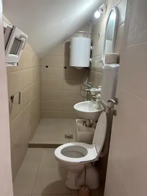 a small bathroom with a toilet and a sink at Banjica 2 in Soko Banja