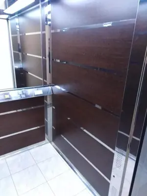 a shower with a glass door in a room at Apartman Radmanovac 2 in Vrnjačka Banja