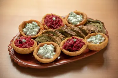 a plate of food with appetizers on a table at KONAK LJUBICA Rtanj in Boljevac
