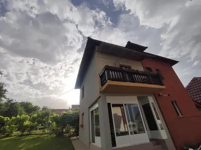 a small house with a balcony on top of it at Konak Mali Raj in Vrnjačka Banja