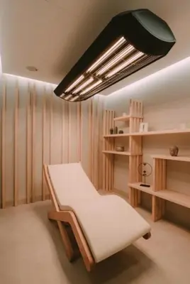 a room with a bed and a light fixture at Imperia Apartments in Vrnjačka Banja