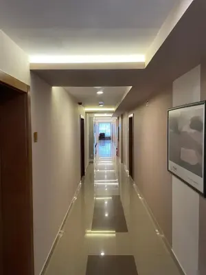 a hallway in a building with a long corridor at Imperia Apartments in Vrnjačka Banja