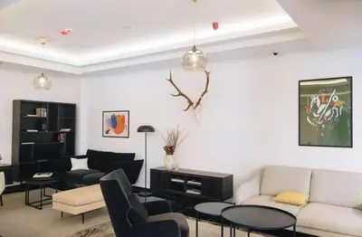 a living room with a couch and chairs at Imperia Apartments in Vrnjačka Banja