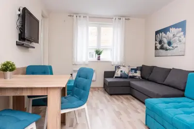 a living room with a couch and a table at Studio Borići in Soko Banja