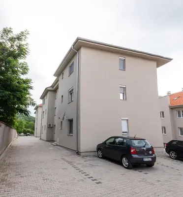 a black car parked in front of a building at Studio Borići in Soko Banja