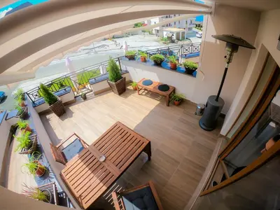 an overhead view of a balcony with a table and bench at Kopaonik Milmari L42 in Kopaonik