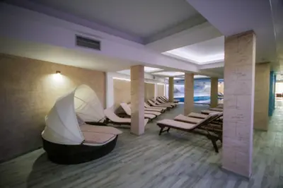 a waiting room with a row of chairs and tables at Kopaonik Milmari L42 in Kopaonik