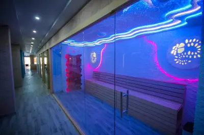 a room with a blue and purple wall with a bench at Kopaonik Milmari L42 in Kopaonik