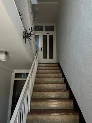a staircase leading up to a door in a house at Apartman Tadeus in Soko Banja