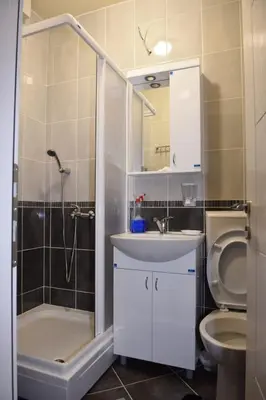 a bathroom with a shower and a sink and a toilet at Apartman TRIM in Vrnjačka Banja