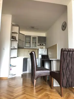 a kitchen with a table and chairs in a room at Apartman TRIM in Vrnjačka Banja