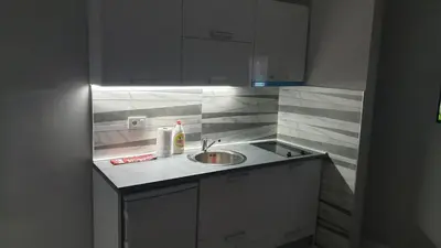a kitchen with a sink and a counter top at Apartman Sweet dreams 2 in Niš