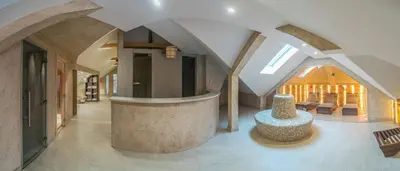 a living room with a large room with a table at Vila Emilia in Vrnjačka Banja