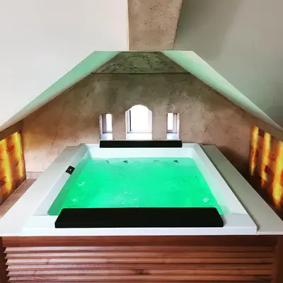 a swimming pool in the middle of a house at Vila Emilia in Vrnjačka Banja