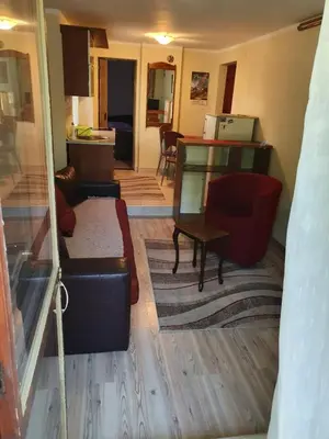 a living room with a couch and a table at Apartman Sergej 2 in Soko Banja