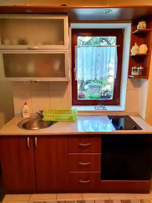 a kitchen with a sink and a window at Apartman Sergej 2 in Soko Banja