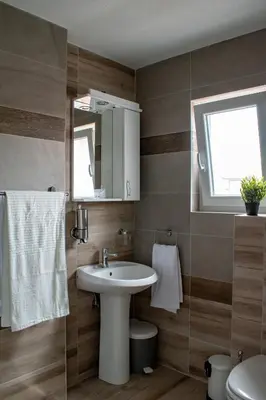 a bathroom with a sink and a mirror at Apartments Due Mondi in Vrnjačka Banja