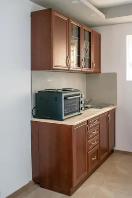 a kitchen with a microwave on top of a counter at Apartments Due Mondi in Vrnjačka Banja