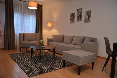 a living room with a couch and a table at Apartman Favorito 327 in Vrnjačka Banja
