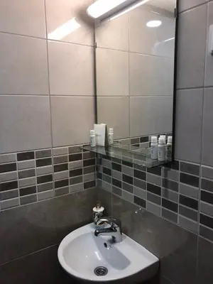 a bathroom with a sink and a mirror at Apartmani & SPA Matin Breg in Jošanička Banja
