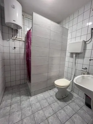a bathroom with a toilet and a sink at Smestaj Katarina in Soko Banja
