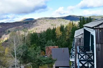 a view of the mountains from a barn at Hiona Apartment in Kopaonik