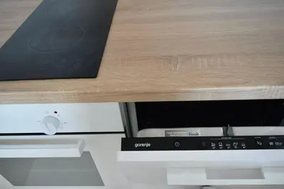 a close up of a microwave under a table at Hiona Apartment in Kopaonik